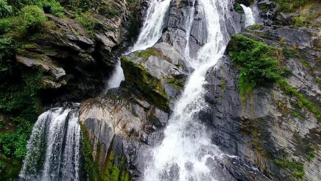 Video of slow motion and tilt down camera movement at Krung Ching Waterfall in rainning season. There is placed in Abundant forest at Nakhon Si Thammarat province.
