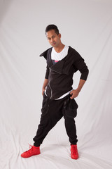 Handsome man in black outfit, looking thoughtful