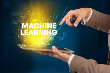 Close-up of a touchscreen with MACHINE LEARNING inscription, innovative technology concept