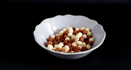 Chocolate balls Breakfast on a black background. Suitable for mockups and advertising backgrounds