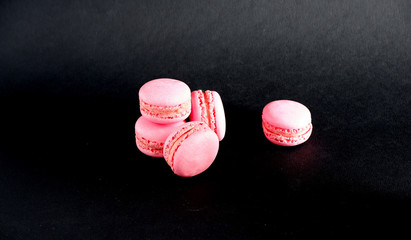 Macaroons on a black background. Suitable for mockups and advertising backgrounds