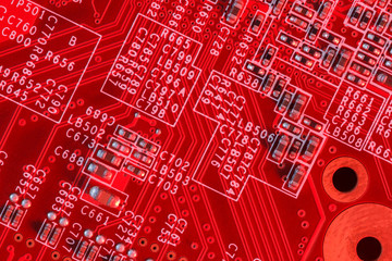 Electronic Printed Circuit Board in red with Electronic components- top view