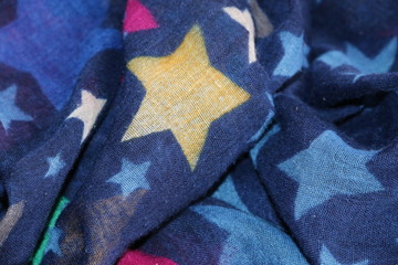 fondo abstracto con texturas textiles y estrellas de colores