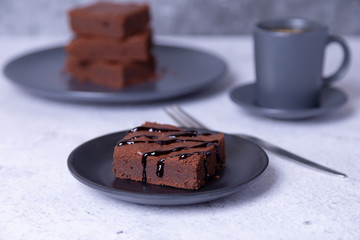 Brownie cake with Chocolate Sauce. Homemade Chocolate Dessert. A popular dark chocolate cake. Close-up.