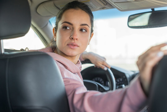 Driver Woman Going In Reverse