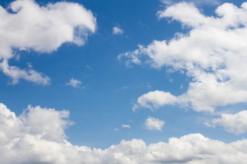 Naklejka na ściany i meble Blue sky with cumulonimbus clouds. Cumulus clouds.