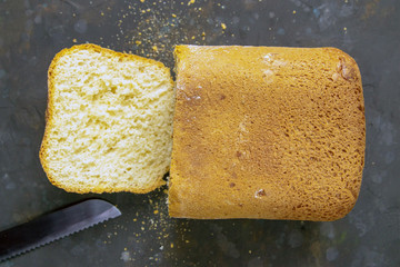 Fresh fragrant bread against a dark background. Assortment of baked bread on dark table background....