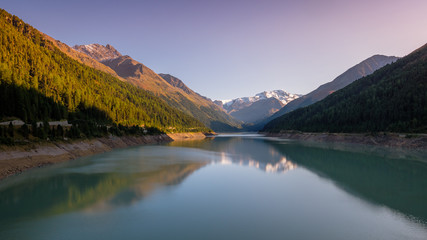 Evening at the gorgeous Gepatsch Reservoir in the Kauner Valley (Tyrol, Austria). This valley features one of the most beautiful mountain roads, the Kauner Valley Glacier Road.