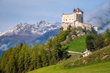 Naklejka premium Mountains surrounding Tarasp castle, in the canton of Graubünden (Engadin) Switzerland. Tarasp is a village in Graubünden, Switzerland. The castle is a Swiss heritage site of national significance