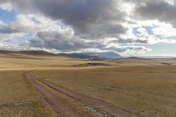 The road in the desert. Central Asia between the Russian Altai and Mongolia