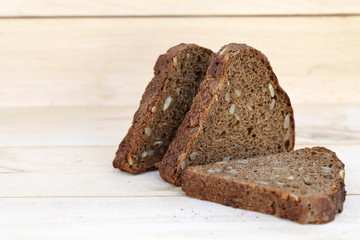 Healthy eating Sliced rye bread on a wooden background