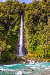 Landscapes of New Zealand. Small high waterfall among the greenery. South Island