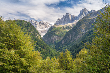 Fototapeta na wymiar Late Summer, early Fall in the mountains near Soglio, a village in the district of Maloja in the Swiss canton of Graubünden close to the Italian border. It lies in Val Bregaglia (Bergell in German)