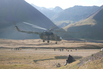 Beautiful landscape of valley between mountains. Helicopter landing.