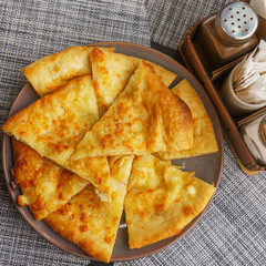 Georgian dish - Megrelian khachapuri. As a filling, young imeritin cheese is used. The salt and...