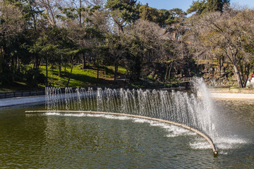 Naklejka premium Fountain on the lake in the historical Yildiz Park in Istanbul. Turkey