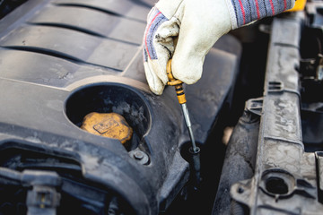 Repairer, transports a broken car on the road and fix problems on vehicle