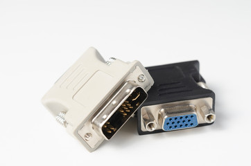 Close-up of     vga and dvi adapters  used for   pc   to monitor  connection   on white  background  .