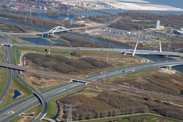 Birds eye view of Diemen junction, The Netherlands. State highways A1 and A9 cross each other. Due to COVID-19, Corona virus lock down, there is much less traffic than usual. Muiderbrug, Uyllanderbrug