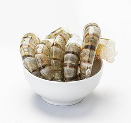 raw headless shrimp in a white plate