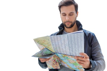 Cutout of young attractive man looking on the map in the city