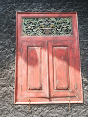 Old wooden windows with Javanese style carvings