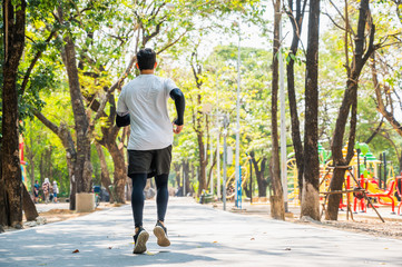 Obraz premium Handsome Healthy runner jogging outdoor. Fitness and sport healthy lifestyle concept.