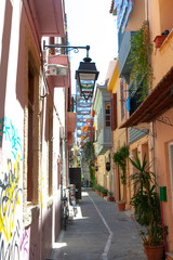 Fototapeta na wymiar An old narrow street in Greece. Beautiful view.