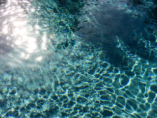 modern swimming pool design aqua blue water sine waves reflections