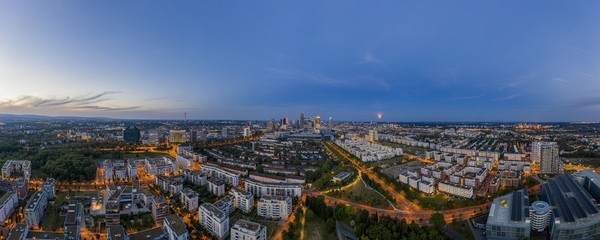 Aerial drone panorama of Frankfurt skyline during sunset from Rebstock park
