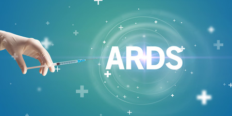 Syringe needle with virus vaccine and ARDS abbreviation, antidote concept