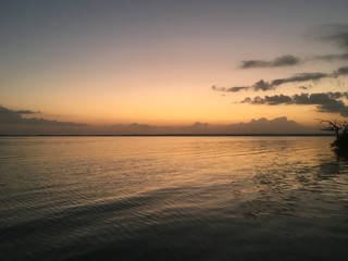 Beautiful ocean view with clean water, evening, night. Amazing background of island, Caribbean, Lagoon Bacalar. Calm secluded place without people, paradise. Sunset or sunrise