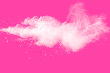 Freeze motion of white particles on pink background. Abstract white dust explosion.