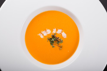 Orange pumpkin soup with prawns