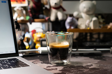 A cup of Black coffee on the world map