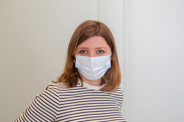 Portret of woman nurse wearing an anti-virus protection mask to prevent flu infection, allergies, virus protection, COVID-19, and corona virus pandemic disease 2019