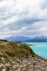 Mountains over turquoise water. Path to Mount Cook, New Zealand