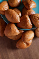 many Russian pies are on the table. Tasty hot homemade Ukrainian pastries. Hot Belarusian food snack lunch bread bakery. Pie with egg, sweet, cabbage, potatoes, jam. brown rosy baked pirogi close up