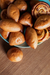 many Russian pies are on the table. Tasty hot homemade Ukrainian pastries. Hot Belarusian food snack lunch bread bakery. Pie with egg, sweet, cabbage, potatoes, jam. brown rosy baked pirogi close up
