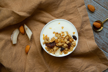 muesli yogurt bowl on brown napkin morning breakfast top view