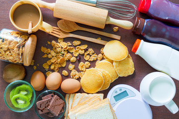 Breakfast served with coffee, orange juice, croissants, cereals and fruits. Balanced diet,Healthy breakfast set with pancakes