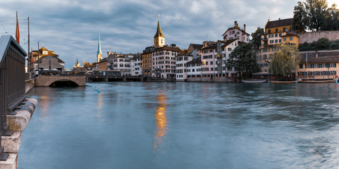 River Limmat with Fraumunster and Church of St Peter in the morning in Old Town of Zurich, the largest city in Switzerland