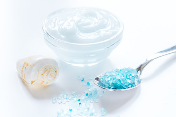 set for bath with salt and shells on white table background