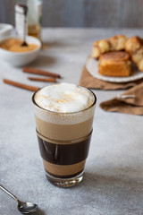 milk cream coffee with brown sugar close up, vertical