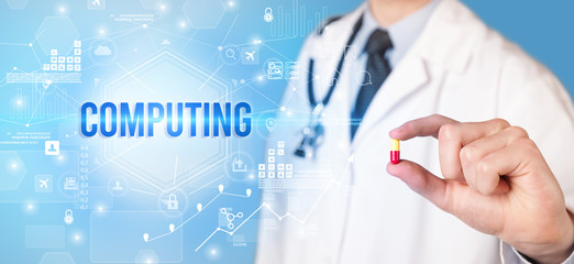 Doctor giving a pill with COMPUTING inscription, new technology solution concept