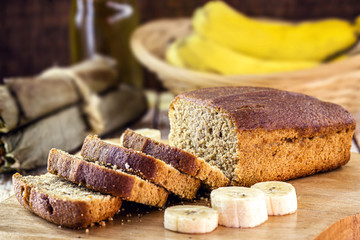 sliced ​​bread on rustic table, vegan bread with banana, oat and honey flavor.