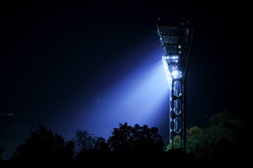 Spotlights over a football field.