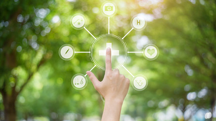 Close up human hand is touching digital medical icons on virtual screen, medical technology concept