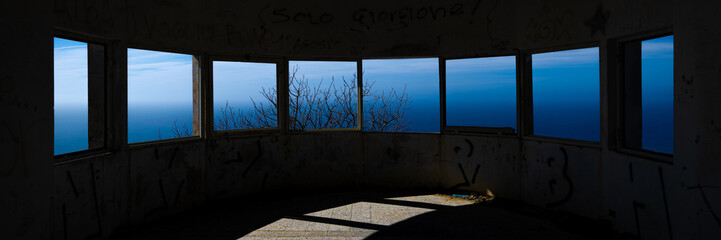 abandoned placwindows of an abandoned observatory on the seae windows overlooking the sea or ocean