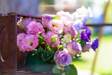 Bouquets of fresh flowers decoration of the festive table. Celebrating an open air party. Decor Details